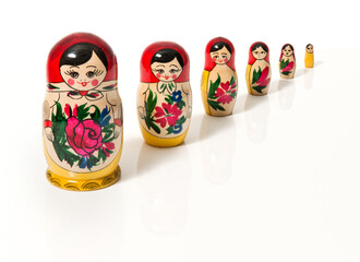 A decrescent row of Matrjoschka on white background