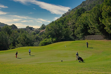 Women playing golf