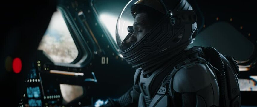 CU Portrait of African American Black male astronaut inside spaceship cockpit. Sci-fi space exploration concept. Mars mission. Shot with 2x anamorphic lens