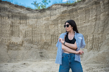 beautiful brunette lady in sand quarry relax and enjoy her time on summer day