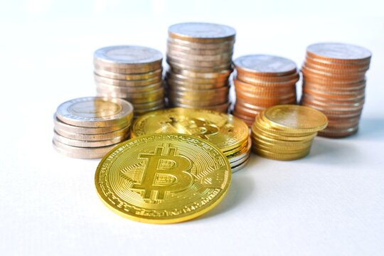 Stack of coins, Bitcoin and other coins that are placed together.  Picture in the concept of finance and economy.