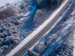 Aerial view of winter highland landscape, Forest, and road to Jihlava city, trees covered with snow and frost, Europe, Vysocina, Czech Republic