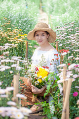 Beautiful asian woman in the flower garden