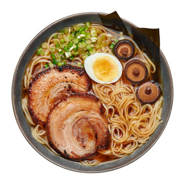 A Shoyu Ramen in gray bowl isolated on white. Japanese cuisine meat noodle soup with chashu pork. Asian food. Top view