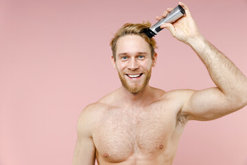 Smiling attractive bearded naked young man 20s years old perfect skin hold electric razor isolated...