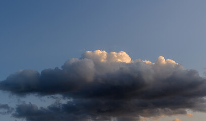 Dramatic sky with white clouds.