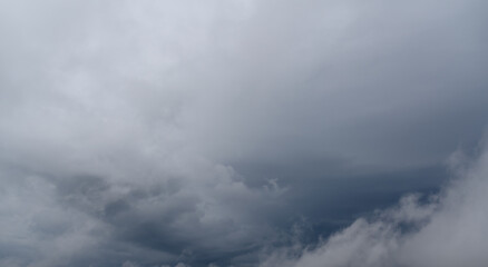 Dramatic sky with white clouds.