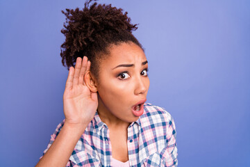 Photo of impressed shocked young lady dressed checkered shirt arm ear listening secrets isolated...