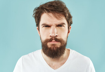 Obraz premium aggression stress man with a beard emotions indignant look fist