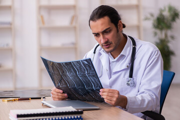 Young male doctor radiologist working in the clinic