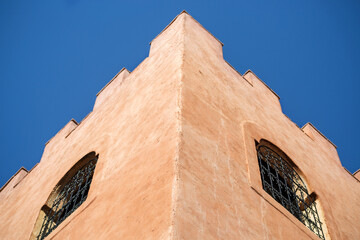 corner of the Moroccan fortress building, bottom-up view, against the sky
