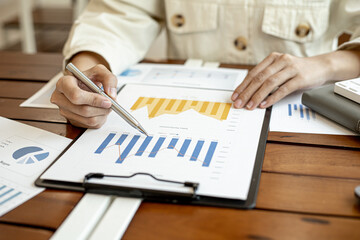 Company finance staff preparing financial documents, company finance staff preparing company...