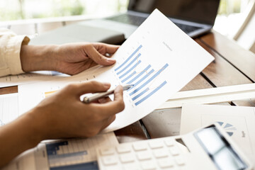 Company finance staff preparing financial documents, company finance staff preparing company...