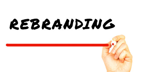 Hand writing REBRANDING with red marker. Isolated on white background.