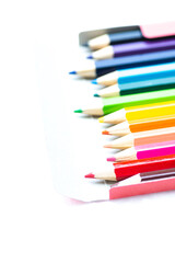 Set of colored pencils on white background.