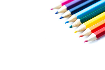 Set of colored pencils on white background.