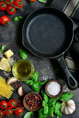 Culinary background with skillet and traditional ongredients of italian cuisine. Top view with copy space.