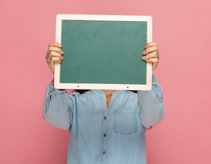 casual woman hiding her face from the camera