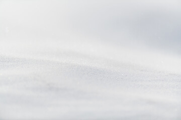 Beautiful winter background with snowy field. Natural winter texture.