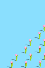 . Creative design card. Gingerbread in the form of a tulip on a blue bright background. The concept of celebrating Women's Day, Valentine's Day. Pattern.