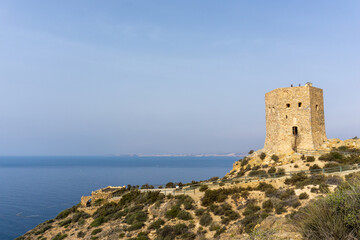 Fototapeta na wymiar the Torre de Santa Elena watchtower above the town of la Azohia in Murcia