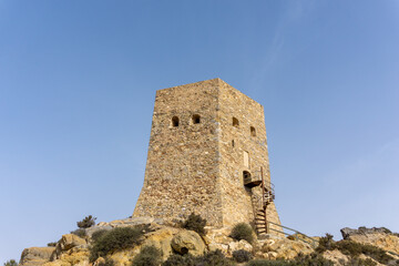 Fototapeta na wymiar the Torre de Santa Elena watchtower above the town of la Azohia in Murcia