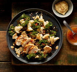 Tasty chicken breast and seared vegetables on plate