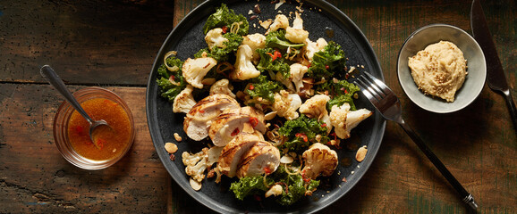 Plate with tasty chicken meat and vegetables