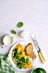 Omelet stuffed with spinach and cheese. Top view with copy space.