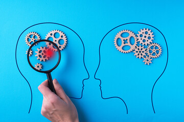Human brain is made gear mechanism. The brain is viewed through a magnifying glass. Brain damage...