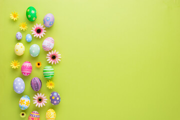 Happy Easter day colorful eggs and flower decoration on paper background with copy space