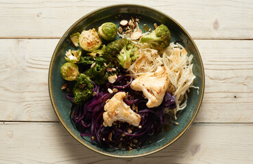 Appetizing noodles and cabbages on plate