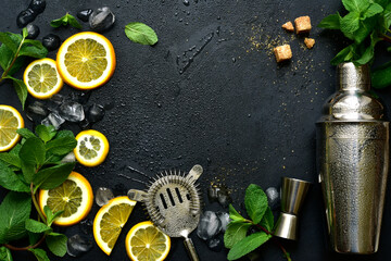 Fresh ingredients for making cold summer citrus cocktail. Top view with copy space.