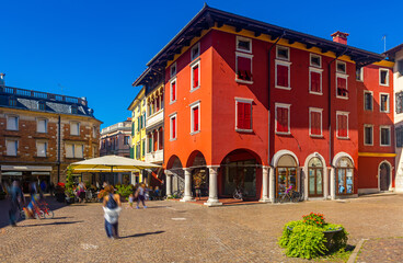 View of busy city square Piazza Paolo Diacono in historic centre of Cividale del Friuli, Italy.