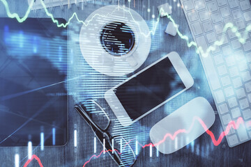 Multi exposure of forex graph hologram over desktop with phone. Top view. Mobile trade platform concept.