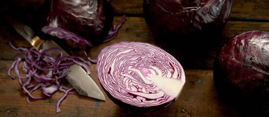 Ripe red cabbages on rustic table