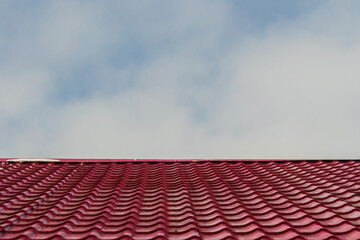 Roof tiles against the blue sky.