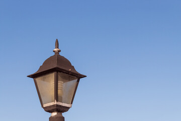 Lantern against the clear blue sky.