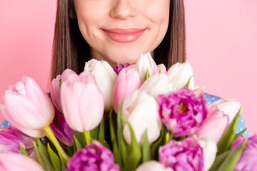 Photo of young beautiful lovely good mood dreamy girl smell sniff bouquet flowers isolated on pink color background