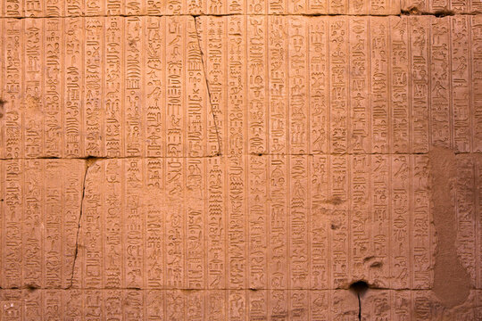 Dendera Temple complex in Egypt. Hieroglypic carvings on wall at the ancient egyptian temple.