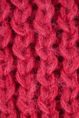 Natural wool texture. Red Knitted wool fabric texture macro close up