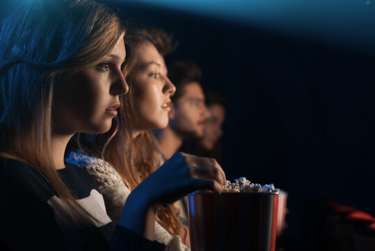 Friends At The Cinema Watching A Movie