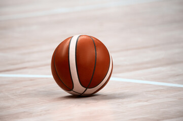 Obraz premium Basketball on basketball parquet floor. Basketball Sports Background