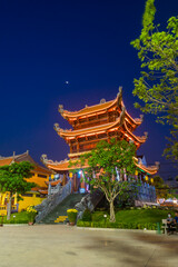 Beautiful traditional decorations and details on the roof of the temple at Vinh Nghiem monastery with many visitor in Ho Chi Minh city, Vietnam