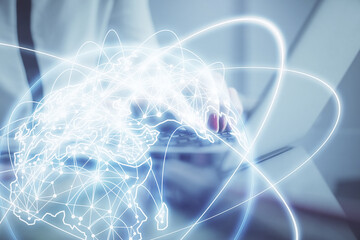 Multi exposure of woman hands typing on computer and business theme hologram drawing. Success...