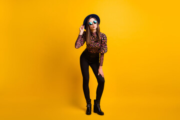 Fototapeta na wymiar Full length body size photo of flirty pretty brunette girl in sunglass pouted lips isolated vibrant yellow color background