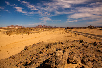 Fototapeta na wymiar Beautiful landscape of sand dunes in Egypt. Sahara Desert. Background of orange sand wave. Africa desert
