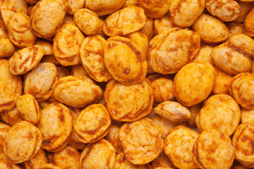 Roasted Crunchy Peanuts in full-frame wallpaper, made with peanuts and coated besan. Indian spicy snacks (Namkeen), Top view.