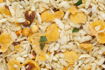 Crunchy Diet Mixture full-frame wallpaper, made with Puffed Rice, Corn Flakes, and Curry leaves. Indian spicy snacks (Namkeen), Top view angle.