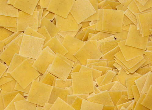 Closeup of raw square-shaped pasta quadretti in a bowl
